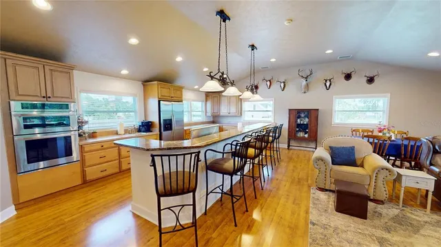 a kitchen with a refrigerator and a sink