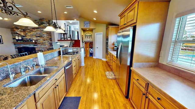 a living room with furniture a flat screen tv and a large window