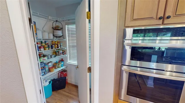 a kitchen with stainless steel appliances granite countertop a sink and cabinets
