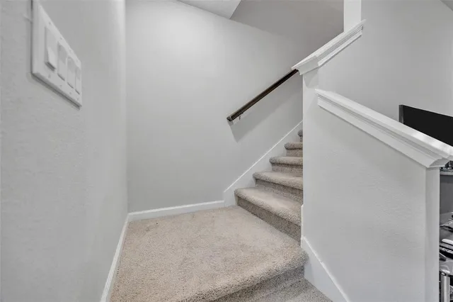 a bedroom with a bed and a table