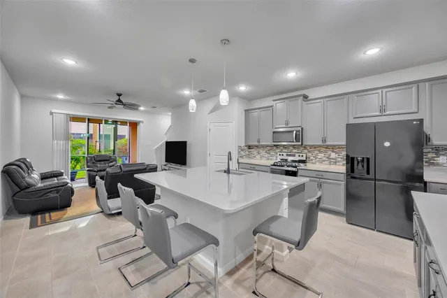 a bedroom with furniture and a flat screen tv