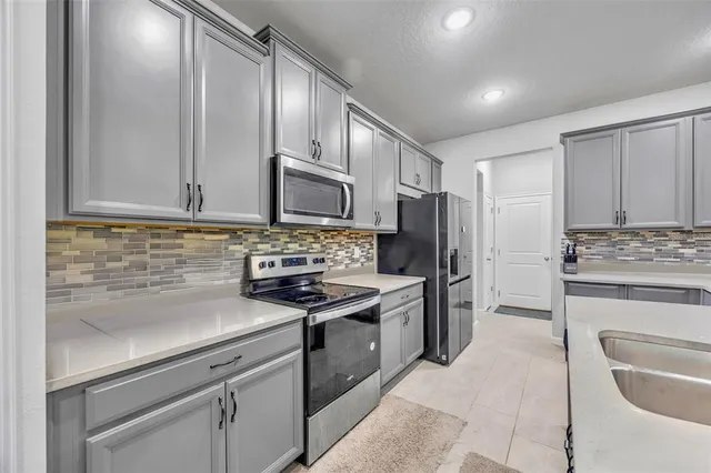 a living room with furniture ceiling fan and a rug