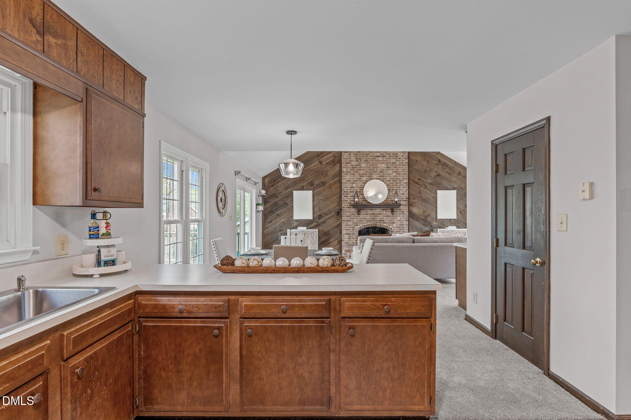 3304 Wade Avenue Raleigh, NC 27607 - Photo 14 of 38 a kitchen with stainless steel appliances granite countertop a sink and cabinets