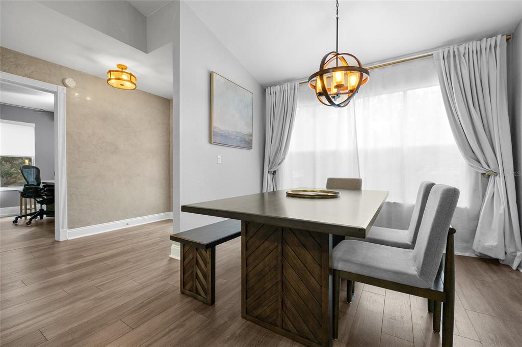 5628 Southwest 104 Terrace Gainesville, FL 32608 - Photo 14 of 31 a view of a room with furniture and wooden floor