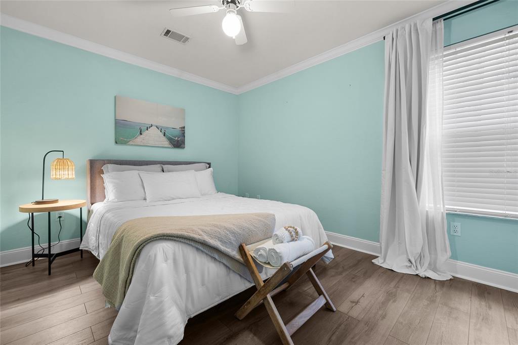 5628 Southwest 104 Terrace Gainesville, FL 32608 - Photo 16 of 31 a bedroom with a bed and a window