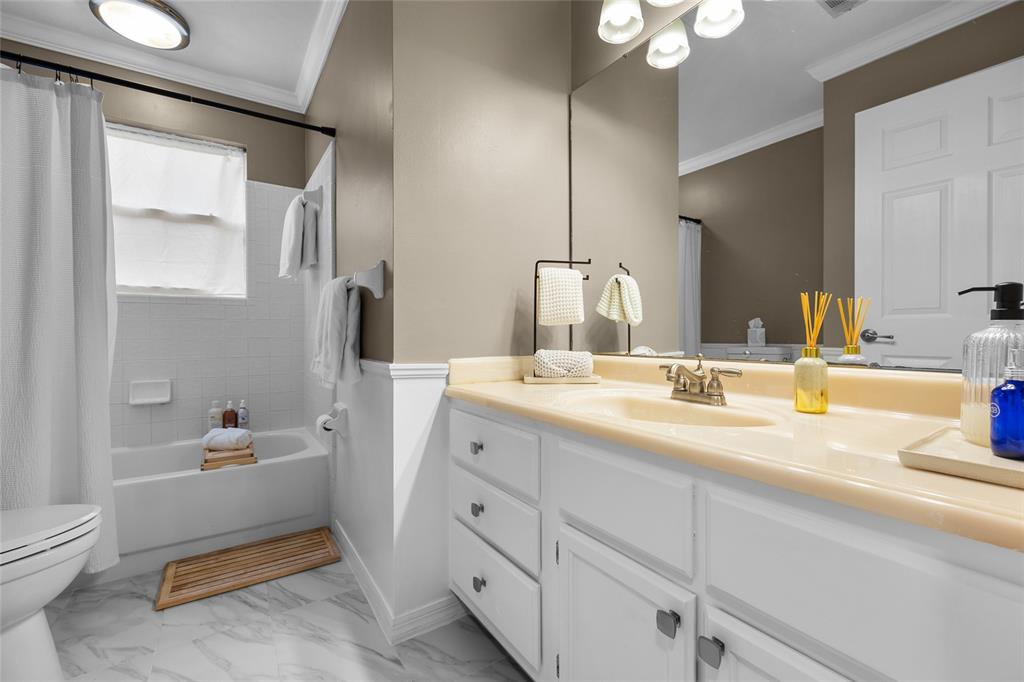 5628 Southwest 104 Terrace Gainesville, FL 32608 - Photo 20 of 31 a bathroom with a sink double vanity and a toilet