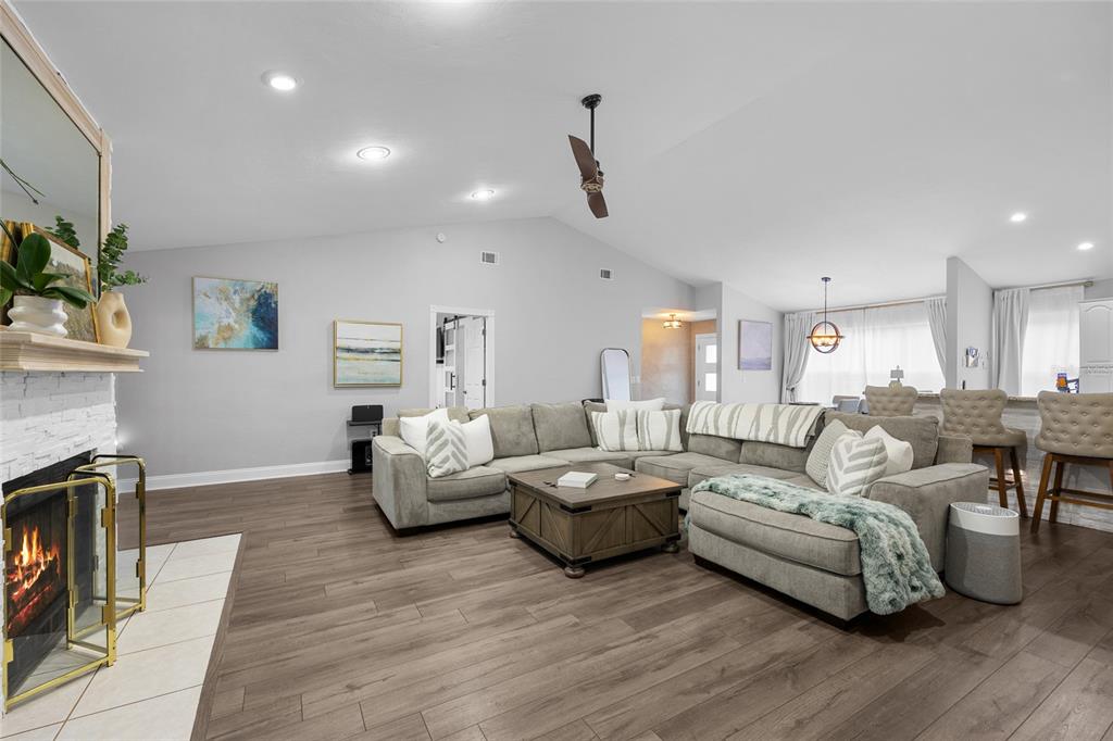 5628 Southwest 104 Terrace Gainesville, FL 32608 - Photo 4 of 31 a living room with furniture and a fireplace