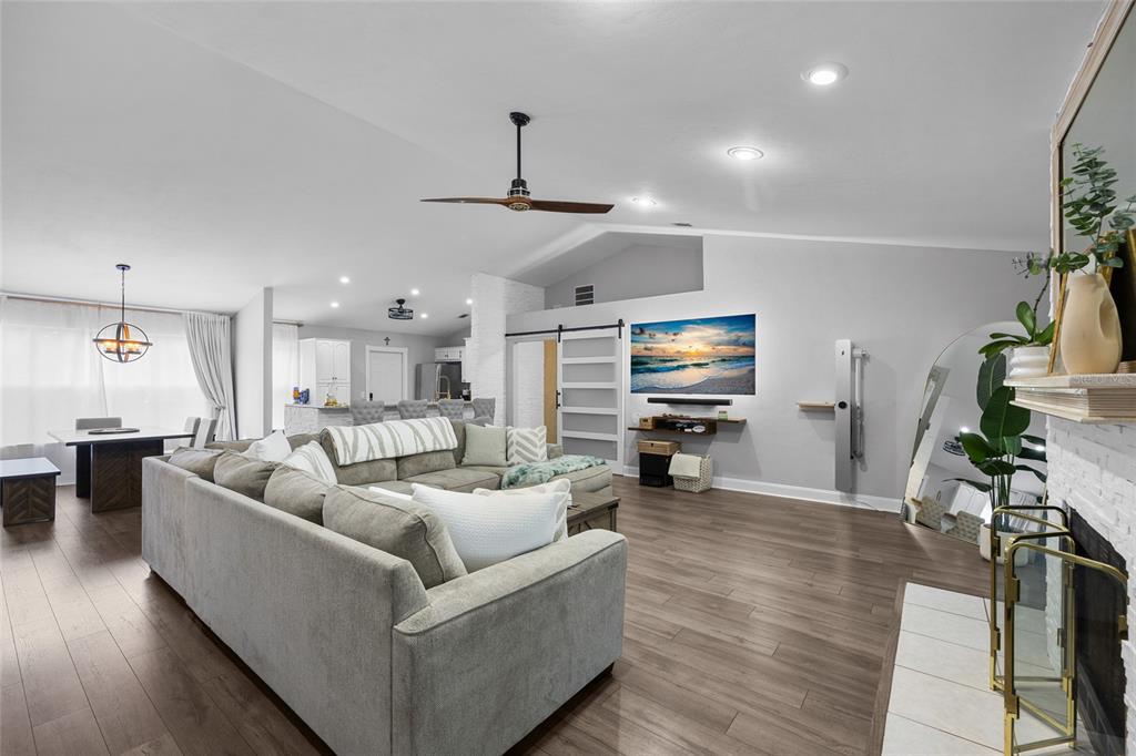 5628 Southwest 104 Terrace Gainesville, FL 32608 - Photo 5 of 31 a living room with furniture and a flat screen tv