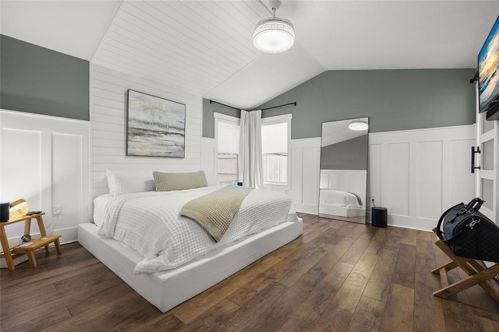 5628 Southwest 104 Terrace Gainesville, FL 32608 - Photo 6 of 31 a spacious bedroom with a bed window and a table