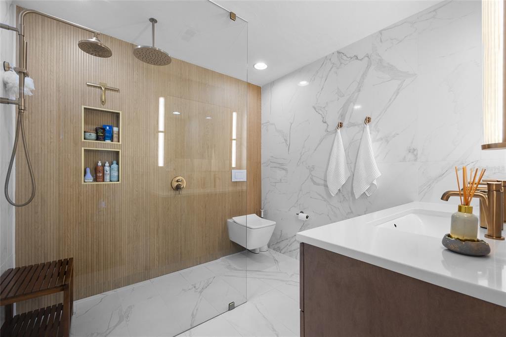 5628 Southwest 104 Terrace Gainesville, FL 32608 - Photo 8 of 31 a bathroom with a sink a toilet and shower