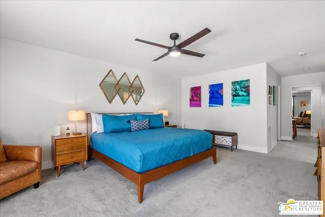 a bed sitting in a room next to a window