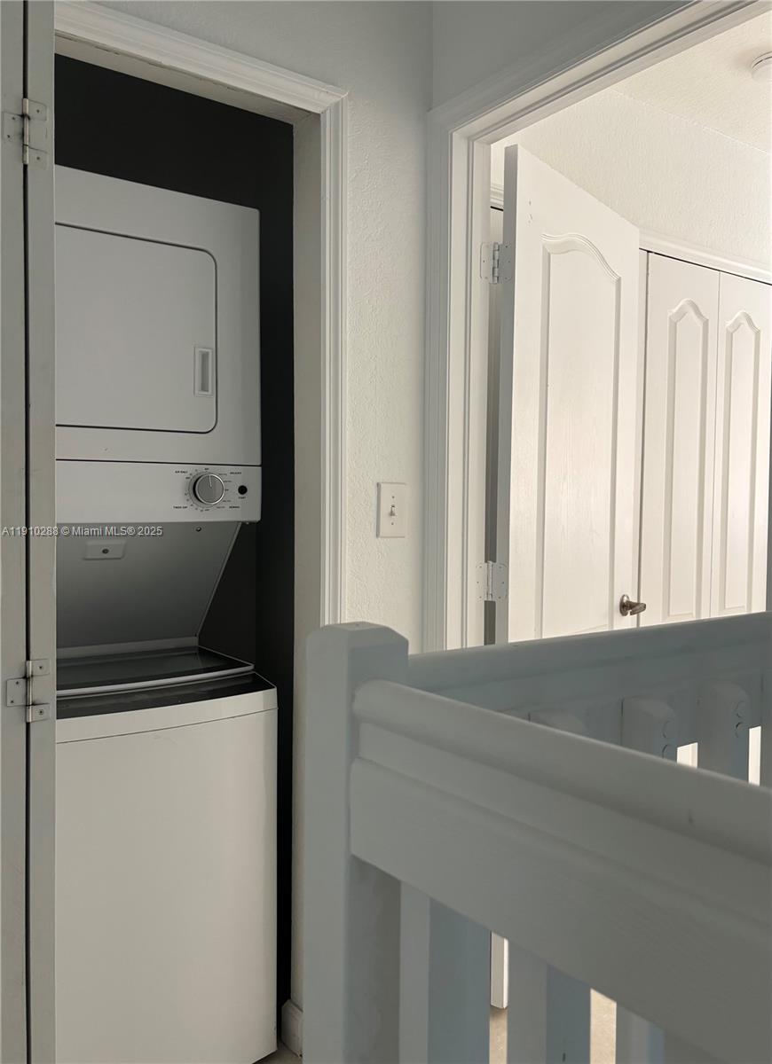 17710 Northwest 73rd Avenue, Unit 20220 Hialeah, FL 33015 - Photo 6 of 16 a utility room with a washer and dryer