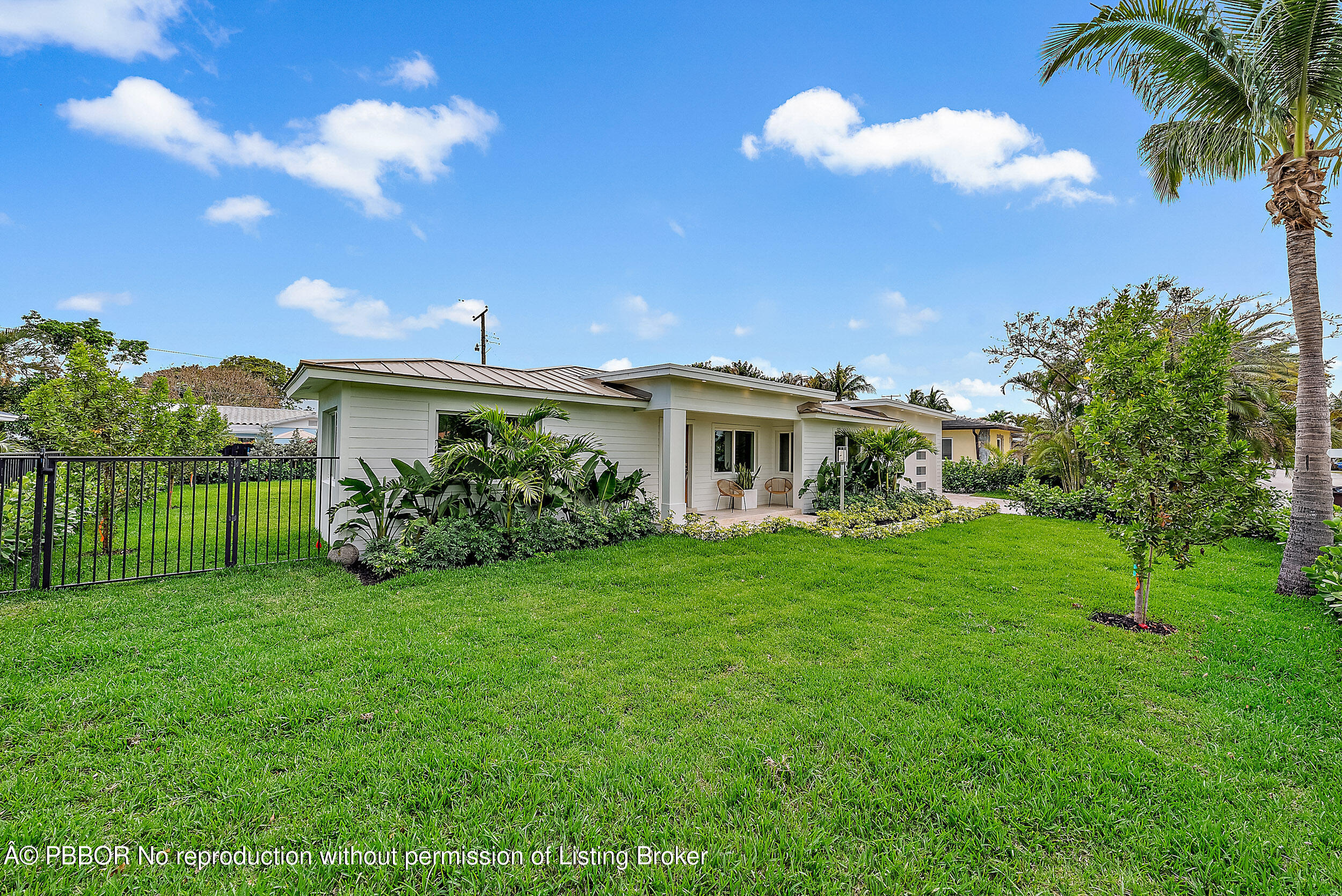 310 Edmor Road West Palm Beach, FL 33405 - Photo 2 of 32 a view of a house with a backyard