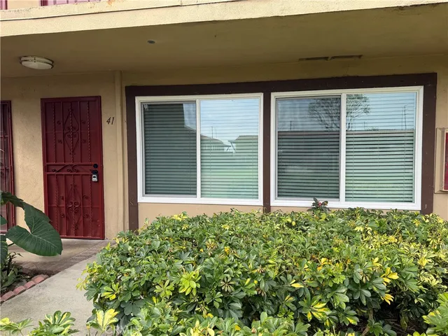 a view of a house with a flower garden