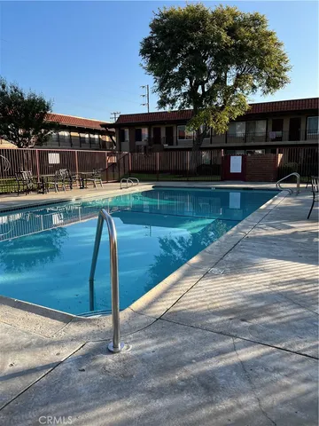 a view of a swimming pool with a patio