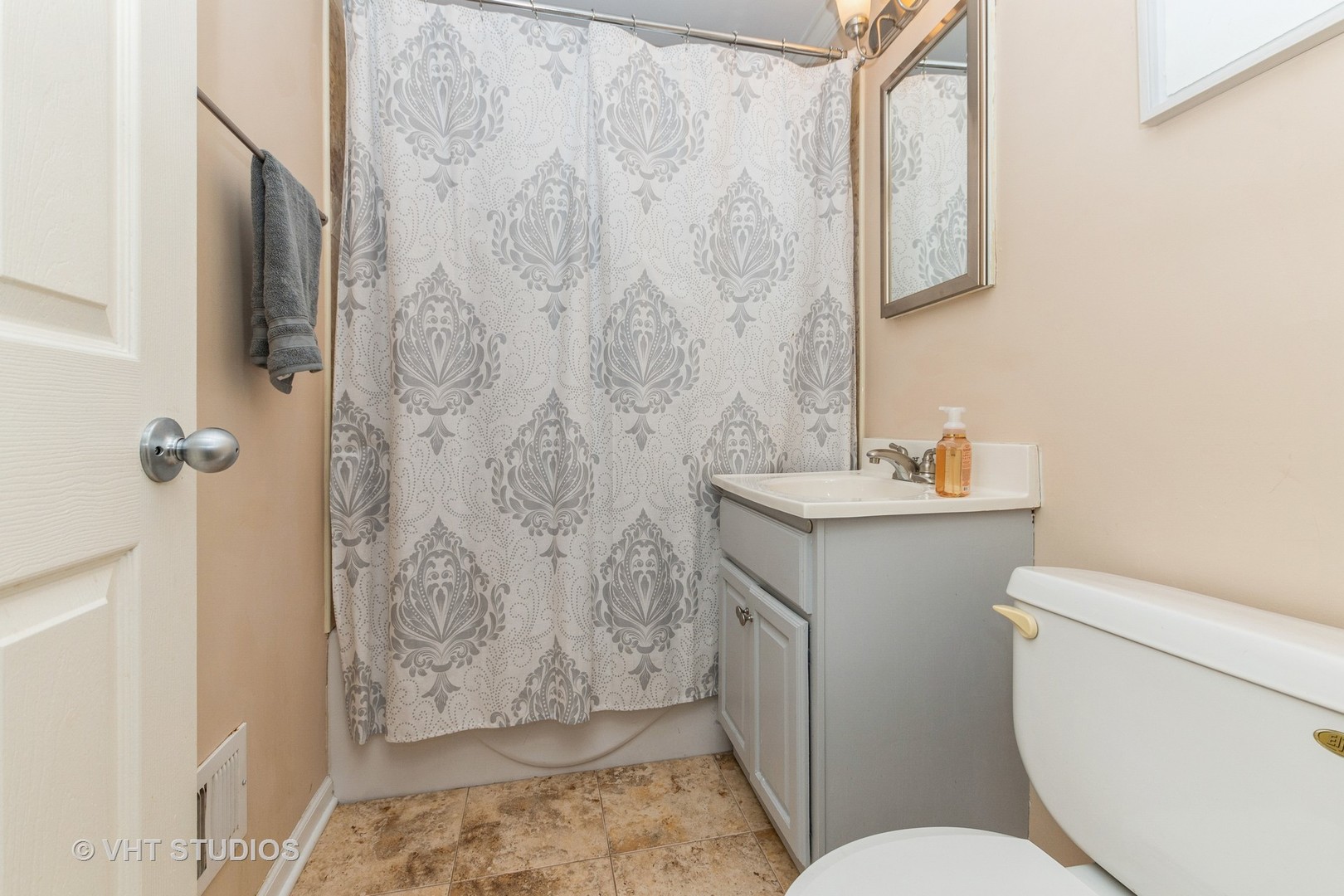 2149 Downey Road Homewood, IL 60430 - Photo 10 of 19 a bathroom with a toilet sink and shower