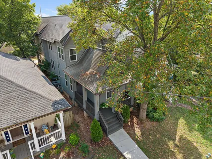 a aerial view of a house with a yard