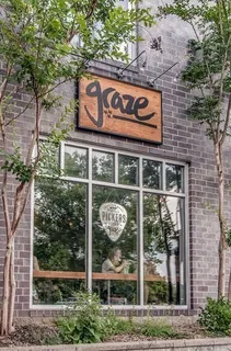 a view of a brick building with a sign on the wall