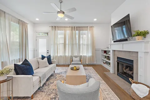 a living room with furniture and a fireplace