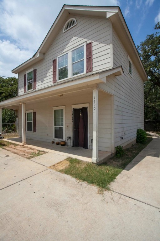 1720 Bunche Road Austin, TX 78721 - Photo 1 of 1 a front view of a house with a yard and garage