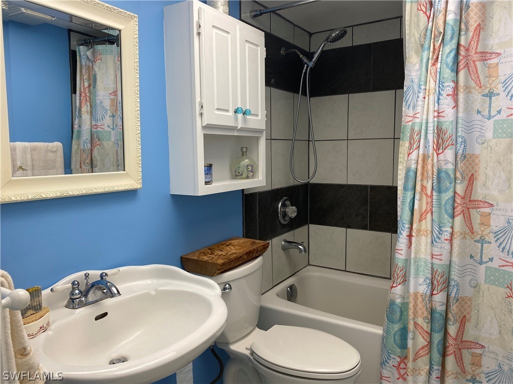 7334 Jonas Road Fort Myers, FL 33967 - Photo 11 of 29 a bathroom with a sink a toilet and shower