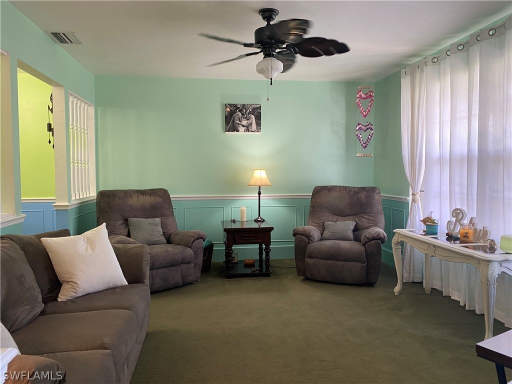 7334 Jonas Road Fort Myers, FL 33967 - Photo 14 of 29 a living room with furniture and a large window