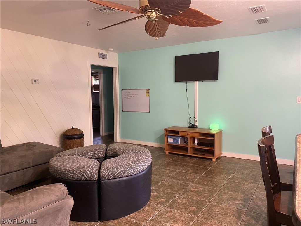7334 Jonas Road Fort Myers, FL 33967 - Photo 18 of 29 a living room with furniture and a flat screen tv
