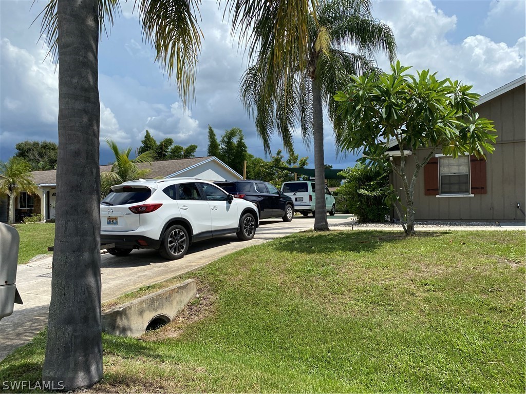 7334 Jonas Road Fort Myers, FL 33967 - Photo 2 of 29 a view of a street with a car parked