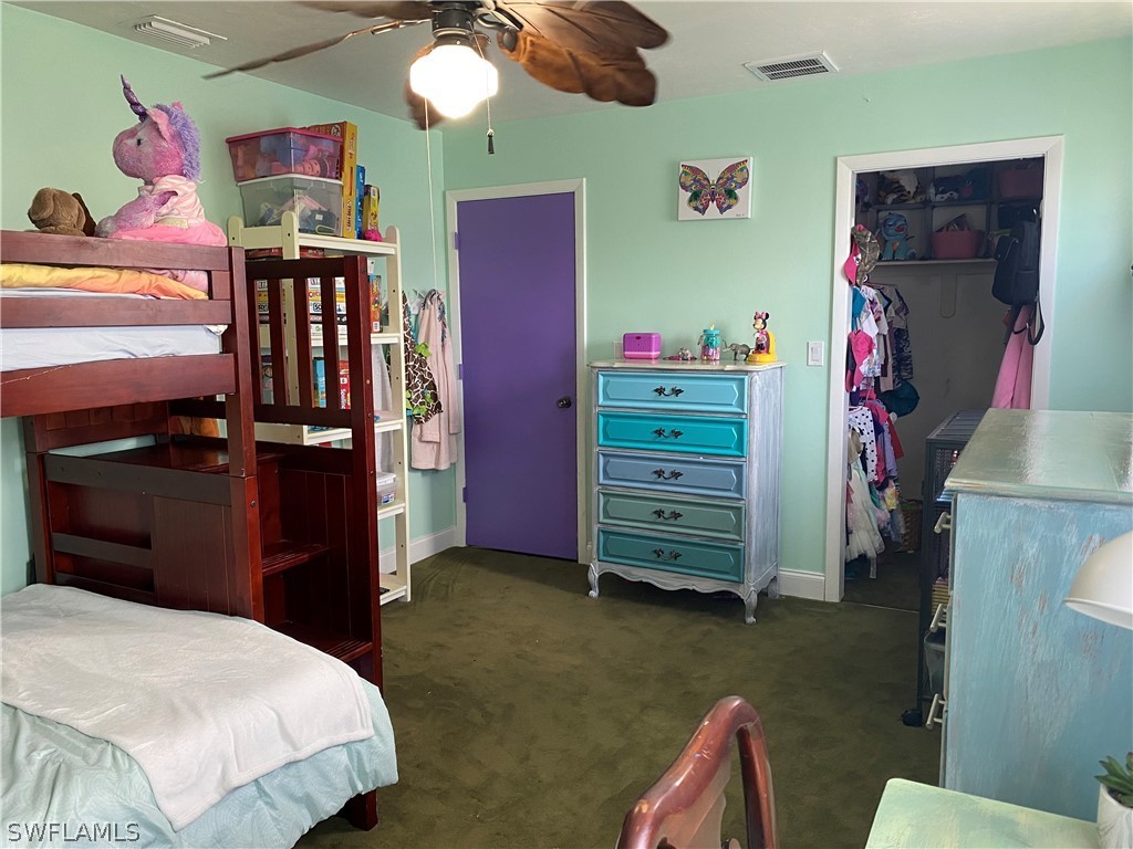 7334 Jonas Road Fort Myers, FL 33967 - Photo 21 of 29 a bedroom with a bed and furniture
