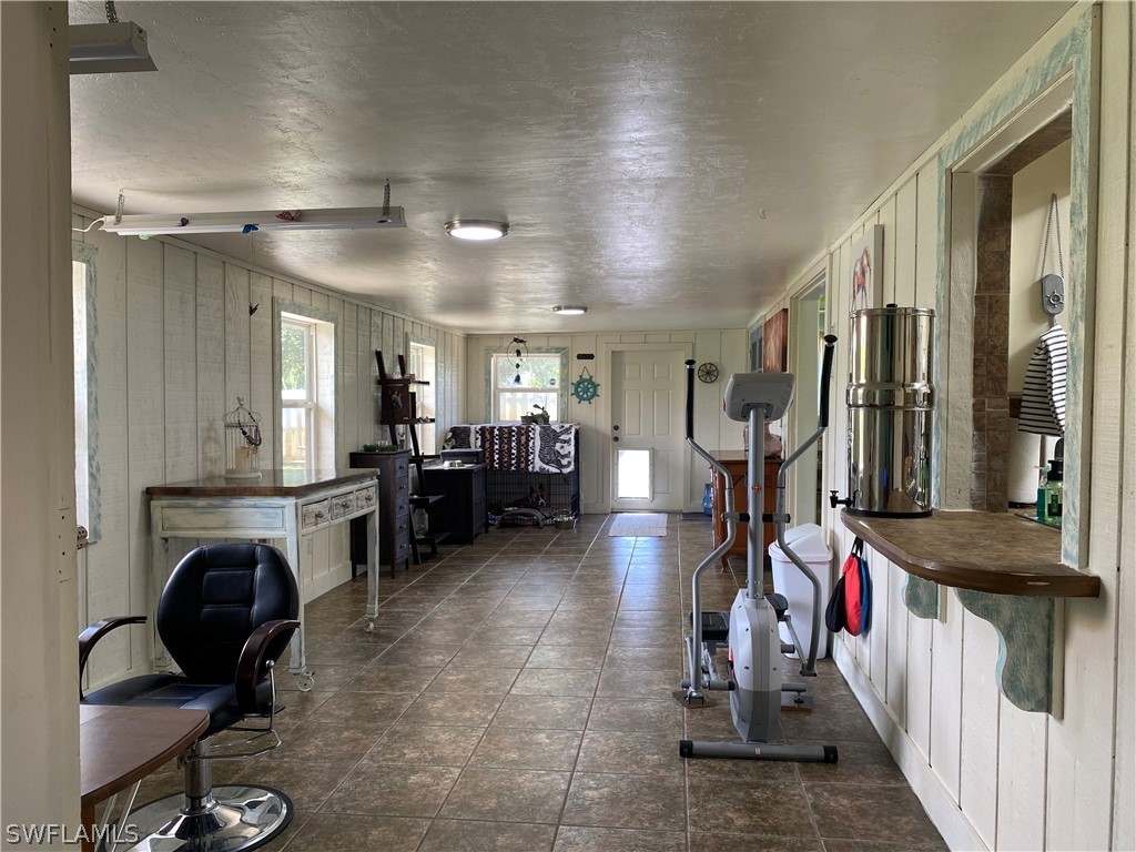 7334 Jonas Road Fort Myers, FL 33967 - Photo 23 of 29 a view of a room with gym equipment