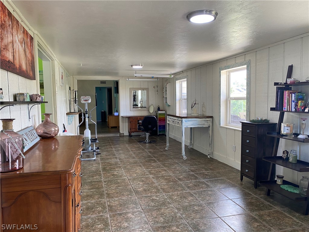 7334 Jonas Road Fort Myers, FL 33967 - Photo 24 of 29 a living room with furniture window and wooden floor