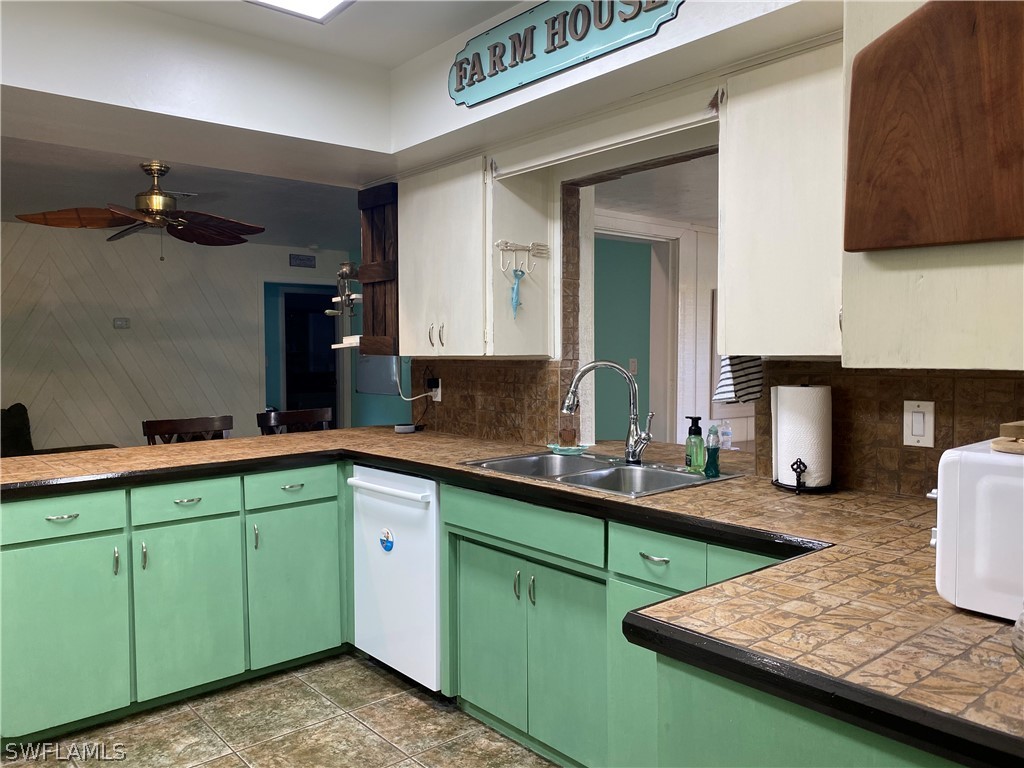 7334 Jonas Road Fort Myers, FL 33967 - Photo 26 of 29 a kitchen with lots of counter space and a sink