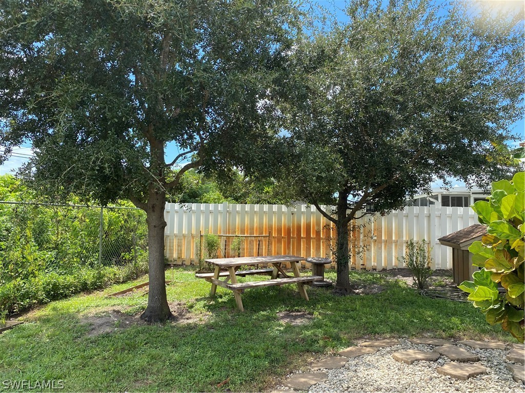 7334 Jonas Road Fort Myers, FL 33967 - Photo 5 of 29 a view of a backyard with a garden and entertaining space