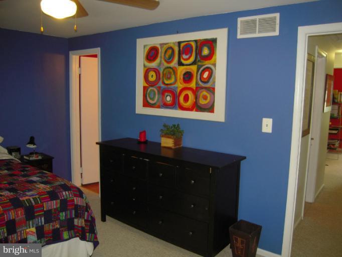4813 Variation Road Nottingham, MD 21236 - Photo 11 of 30 a bedroom with a bed and a dresser