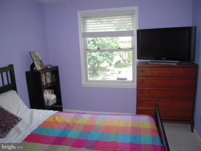 4813 Variation Road Nottingham, MD 21236 - Photo 18 of 30 a bedroom with a bed and a flat screen tv