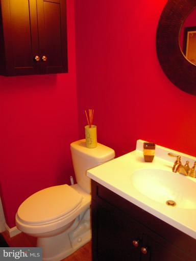 4813 Variation Road Nottingham, MD 21236 - Photo 22 of 30 a bathroom with a toilet sink and mirror