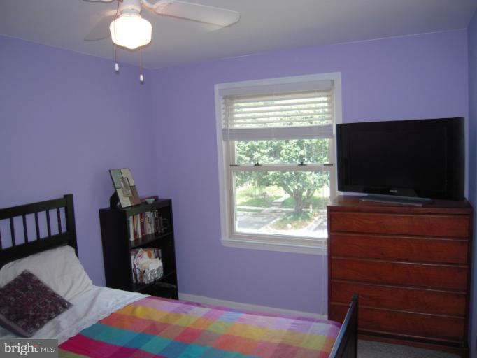 4813 Variation Road Nottingham, MD 21236 - Photo 25 of 30 a bedroom with a bed and a flat screen tv