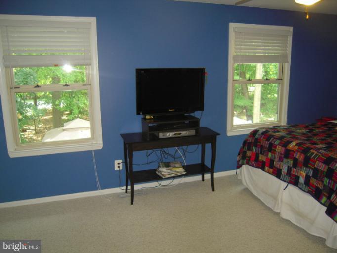 4813 Variation Road Nottingham, MD 21236 - Photo 5 of 30 a bedroom with a bed and a flat screen tv