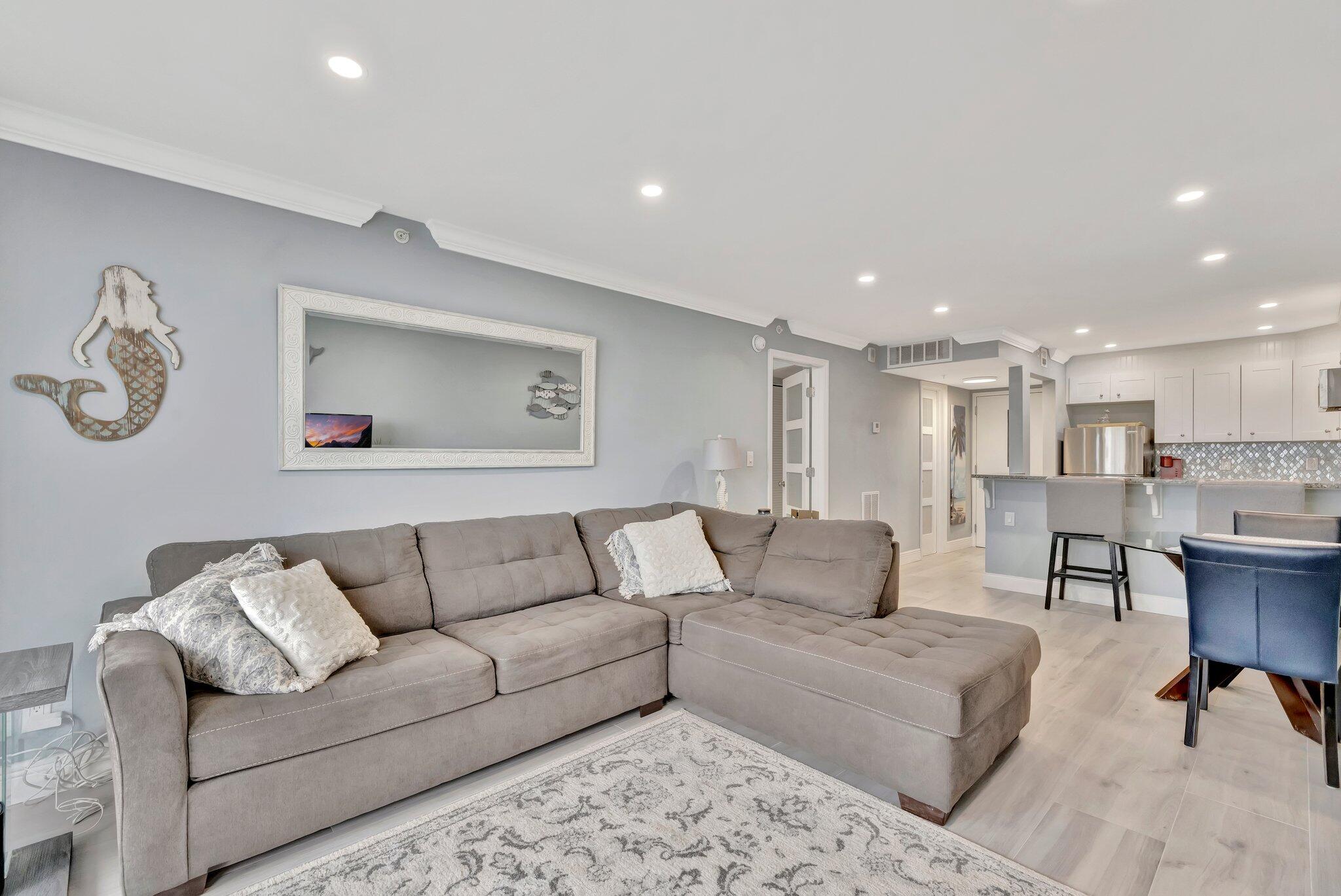 1505 North Riverside Drive, Unit 507 Pompano Beach, FL 33062 - Photo 12 of 39 a living room with furniture and kitchen view