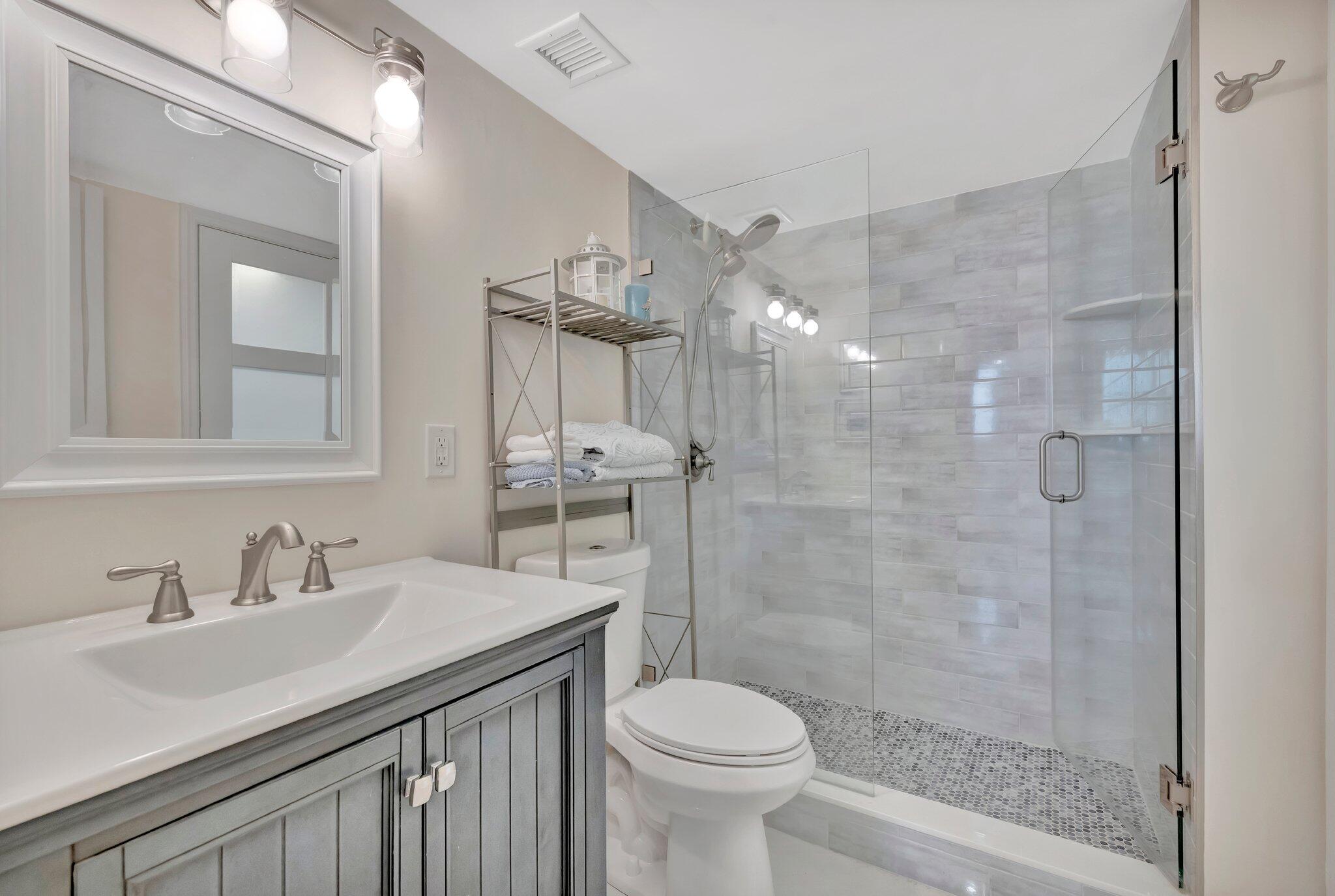 1505 North Riverside Drive, Unit 507 Pompano Beach, FL 33062 - Photo 13 of 39 a bathroom with a sink toilet and shower