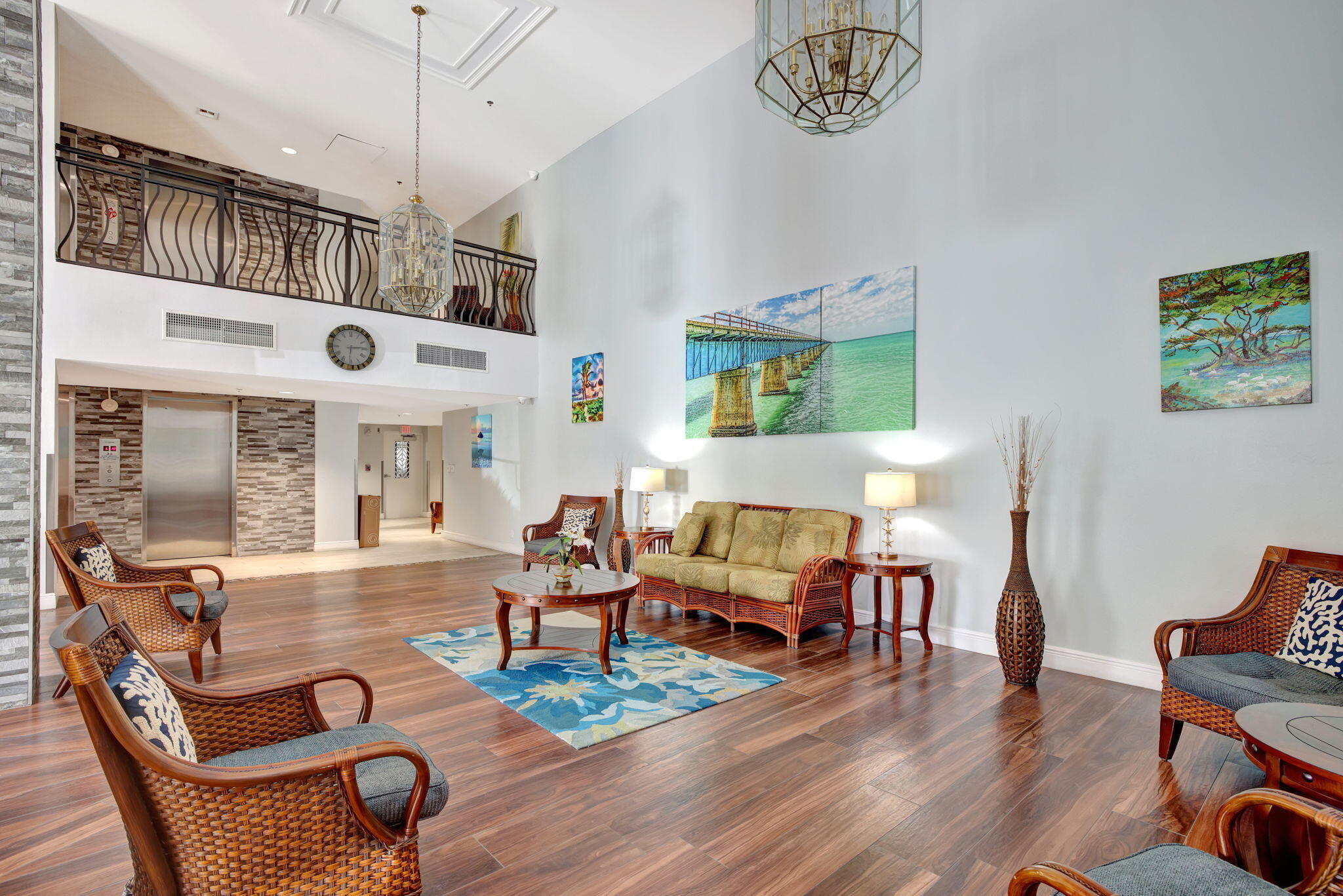1505 North Riverside Drive, Unit 507 Pompano Beach, FL 33062 - Photo 17 of 39 a living room with furniture dining table and a chandelier