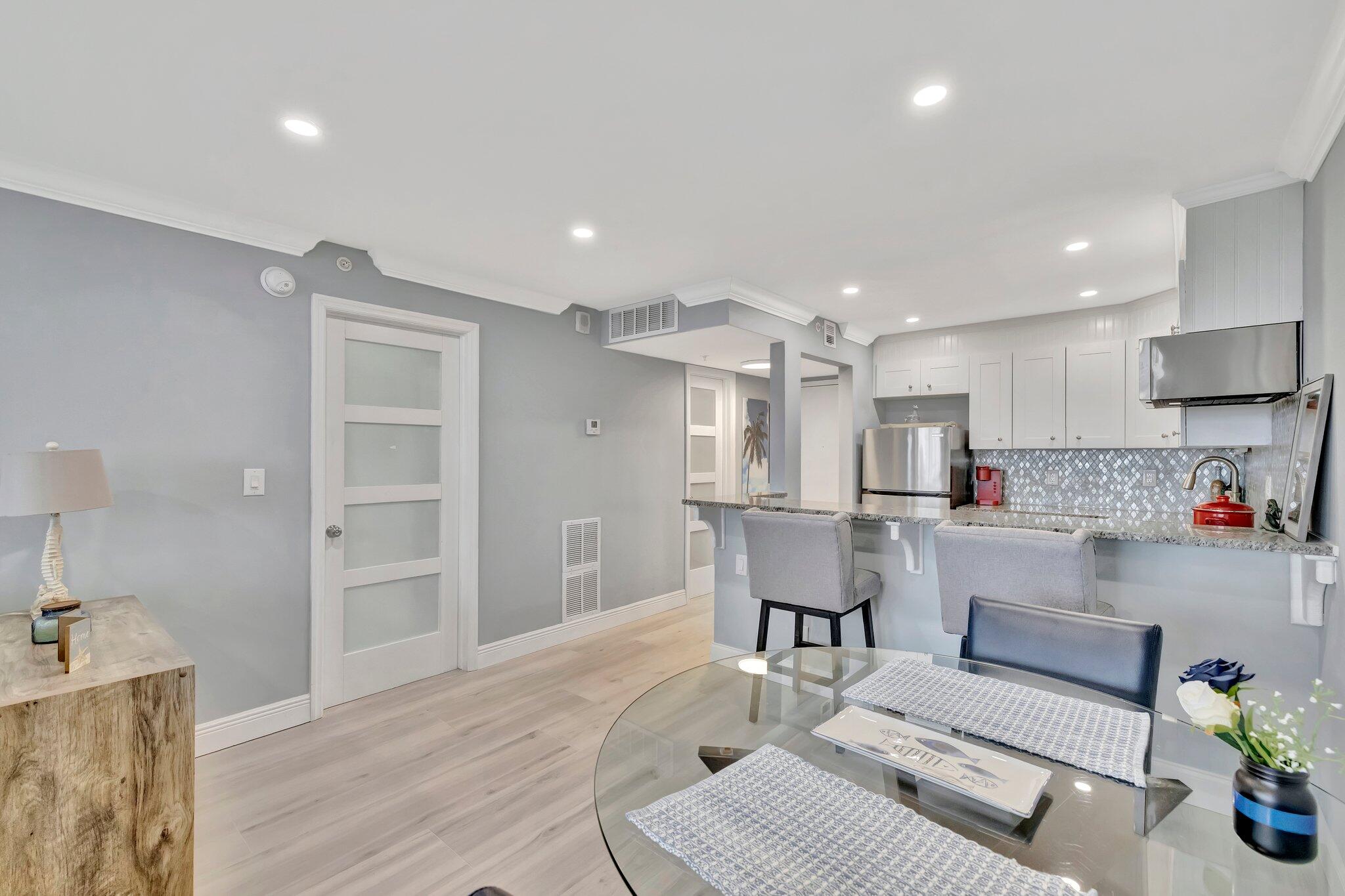 1505 North Riverside Drive, Unit 507 Pompano Beach, FL 33062 - Photo 22 of 39 a living room with furniture and a wooden floor