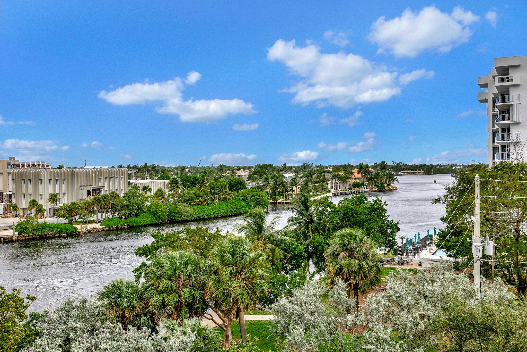1505 North Riverside Drive, Unit 507 Pompano Beach, FL 33062 - Photo 3 of 39 a view of a lake with houses in the back