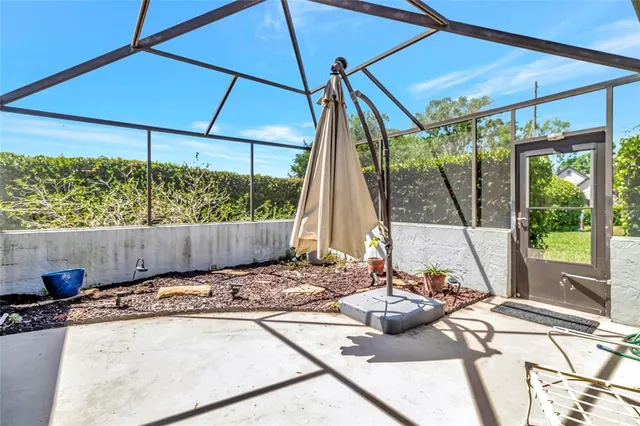 a view of a two chairs in the patio