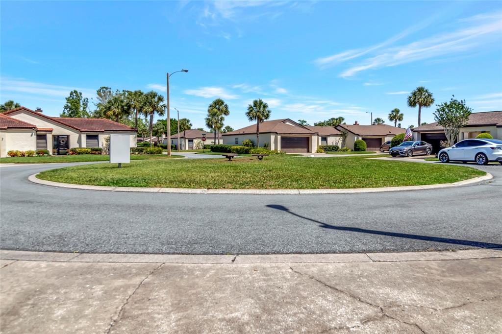 1908 Oak Circle Tavares, FL 32778 - Photo 27 of 28 a view of a house with a yard and garage