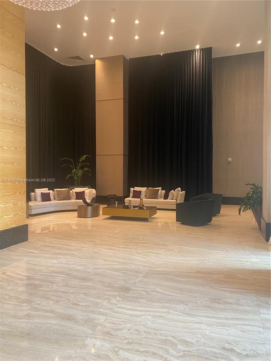 950 Brickell Bay Drive, Unit 602 Miami, FL 33131 - Photo 2 of 16 a view of bathroom with a sink and a mirror