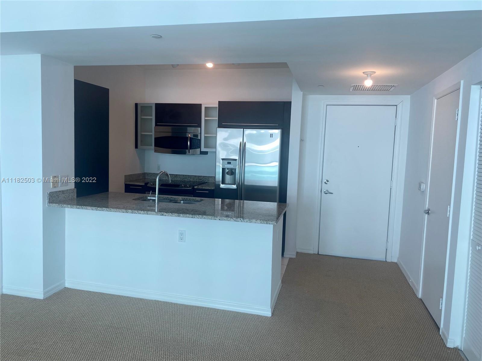 950 Brickell Bay Drive, Unit 602 Miami, FL 33131 - Photo 4 of 16 a view of a living room