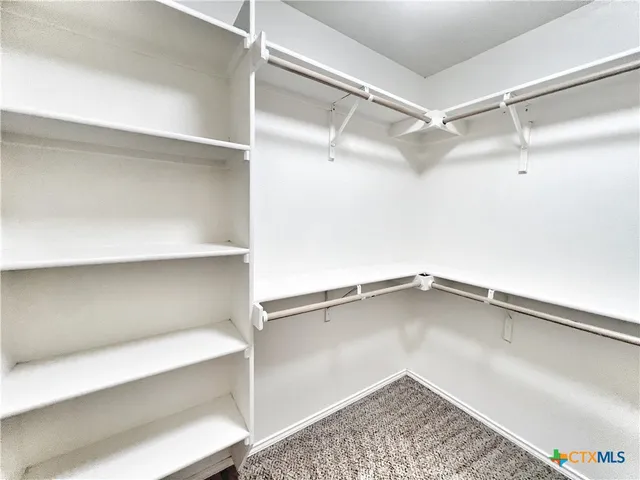 a view of an empty walk in closet