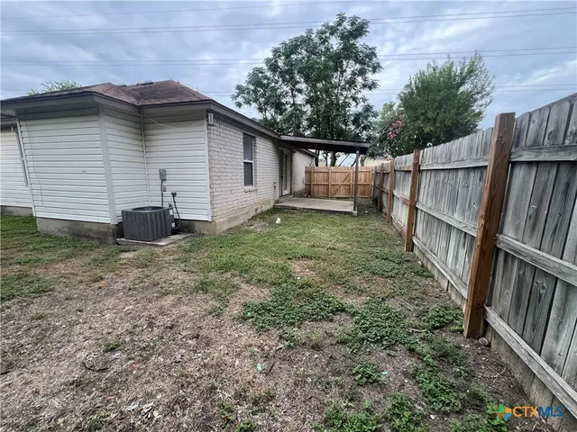 a view of backyard with green space