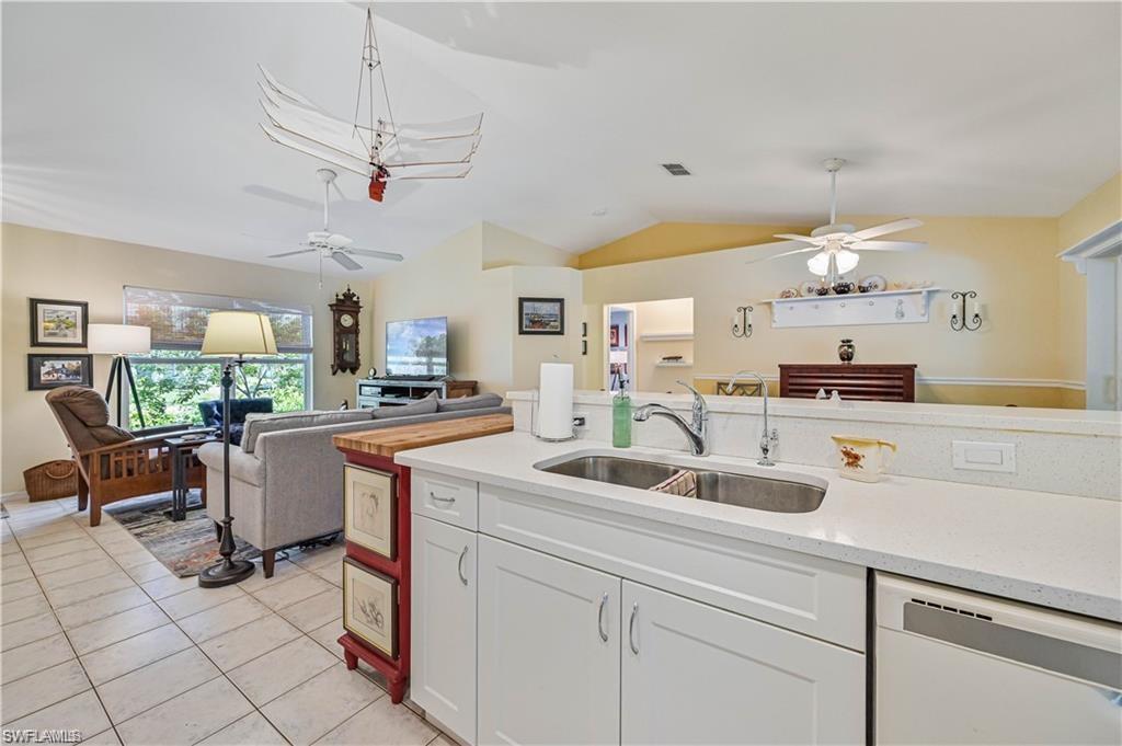 18546 Violet Road Fort Myers, FL 33967 - Photo 13 of 38 a kitchen with a sink a counter space appliances and cabinets